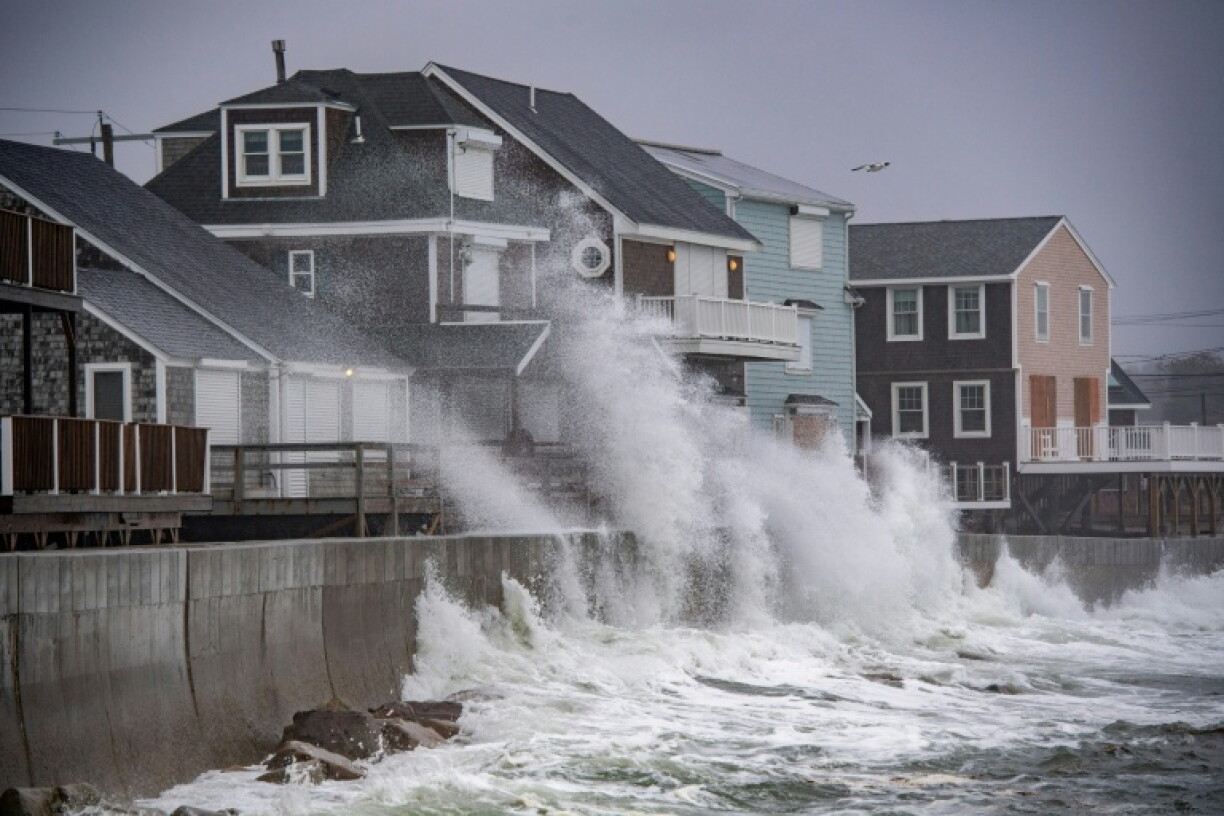 Waves pound the coast as the tide comes in during a Nor'easter storm in Scituate, Massachusetts