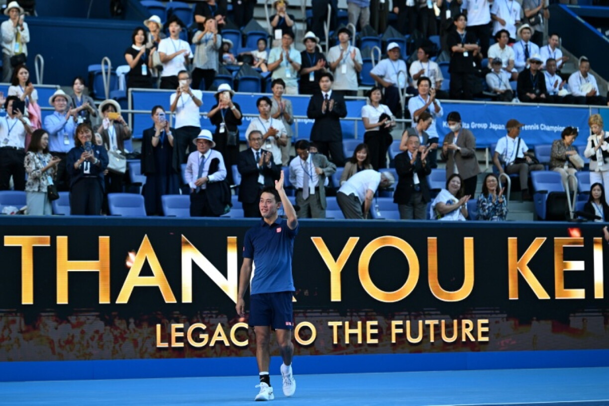 Japan's Kei Nishikori waves to fans as he retires from the sport after his men's singles tennis match against USA's Frances Tiafoe at the ATP Tour Japan Open Tennis Championships at the Ariake Tennis Forest Park in Tokyo on October 1, 2026.
