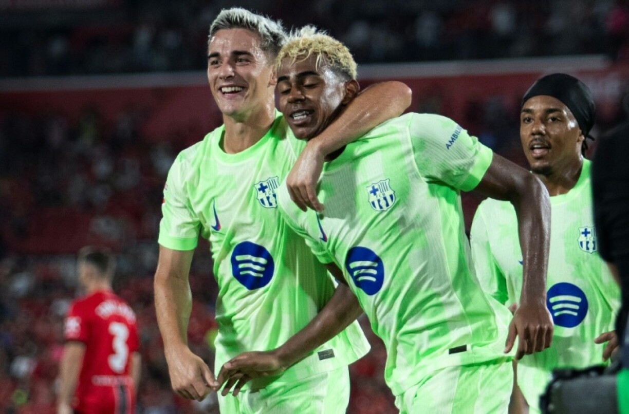 Barcelona's Spanish midfielder Gavi (L) has not played since late August due to the meniscus problem