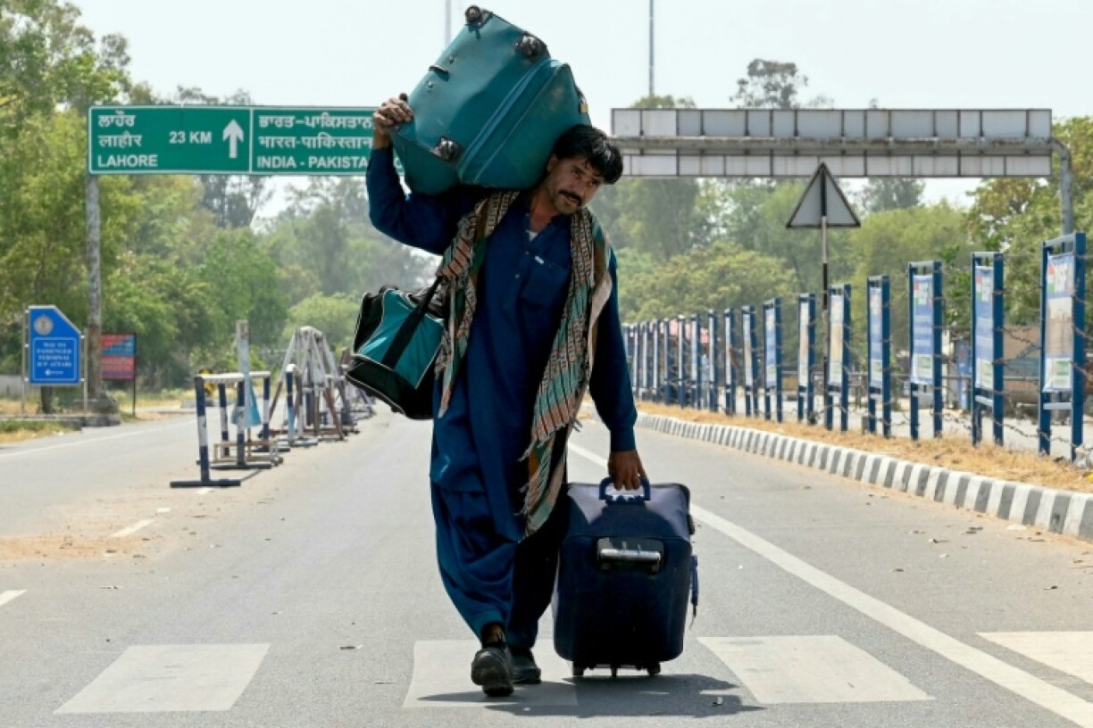 An Indian citizen returns from Pakistan through the Wagah border post