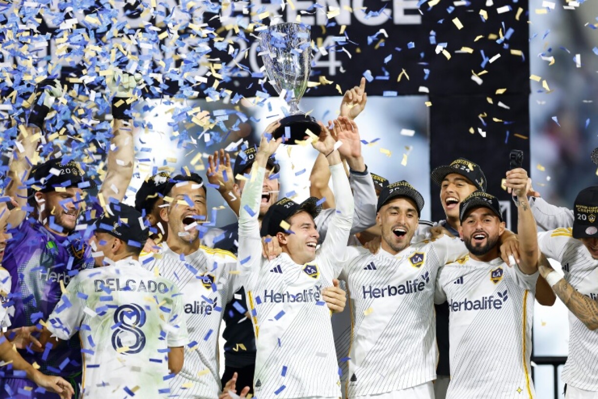 Los Angeles Galaxy players celebrate reaching this weekend's MLS Cup final, a year after the worst season in the club's history