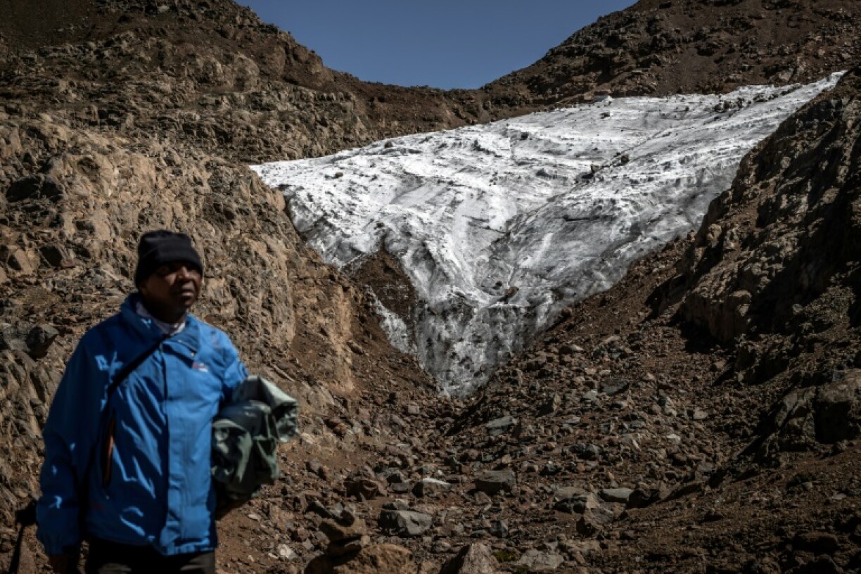 For 25 years mountain guide Charles Kibaki Muchir has seen the glacier's transformation from a landscape of snow and ice to brown rock