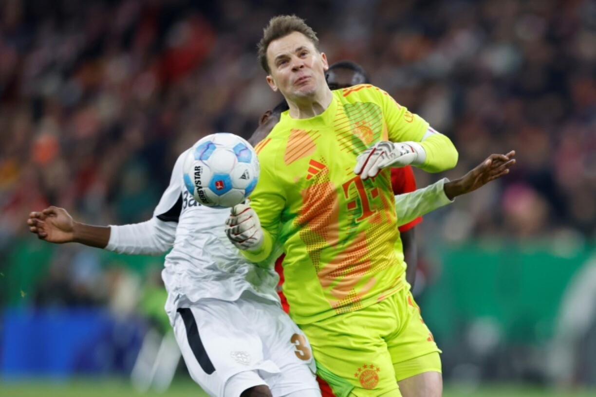 Manuel Neuer (front) fouls Bayer Leverkusen's Jeremie Frimpong, earning a red card and suffering a broke rib that will sideline him until next year