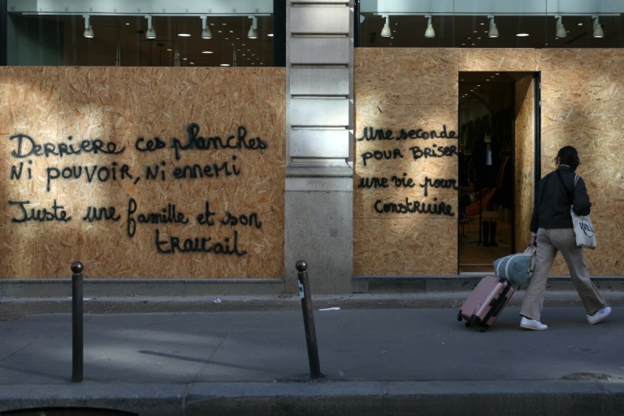 'Behind this boards, no power, no enemy: just a family and its job': Paris is bracing for Saturday's protests Saturday