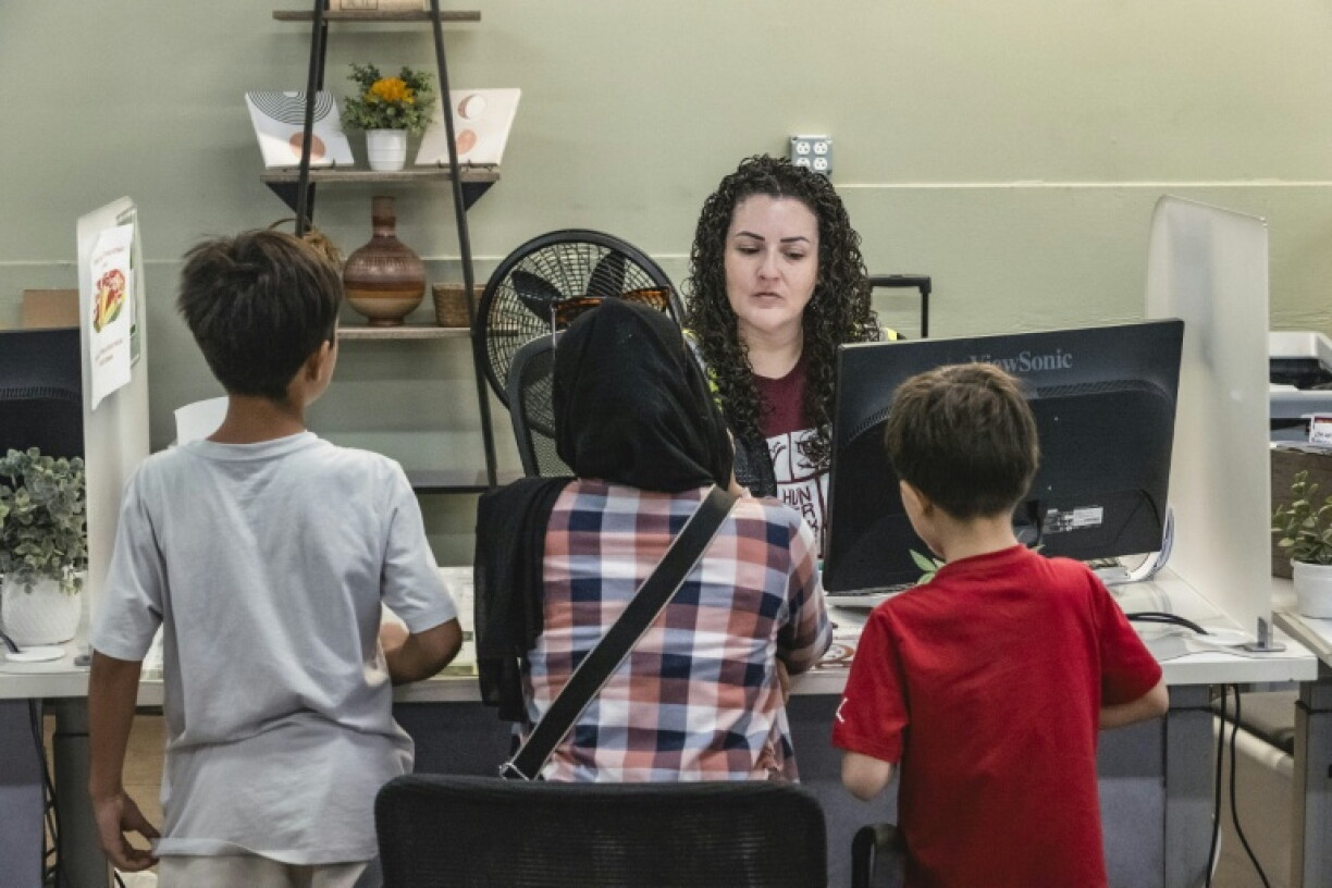 A family registers at an Arizona food bank for assistance