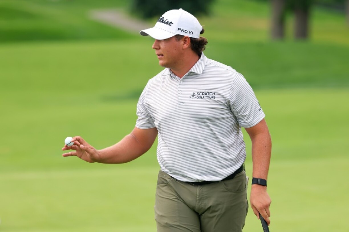South African Aldrich Potgieter acknowledges fans after firing a first-round 62 for a share of the lead at the US PGA Tour Rocket Classic in Michigan