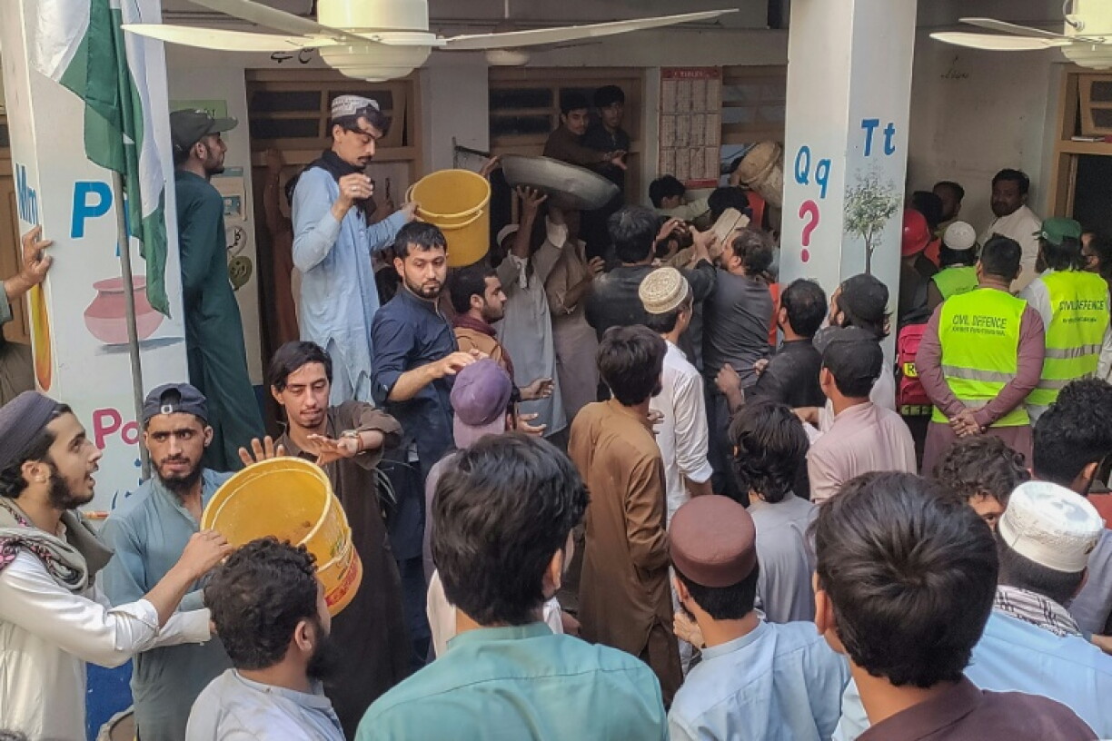 Rescuers and residents gathered at the school to conduct a search operation at a school after a deadly roof collapse