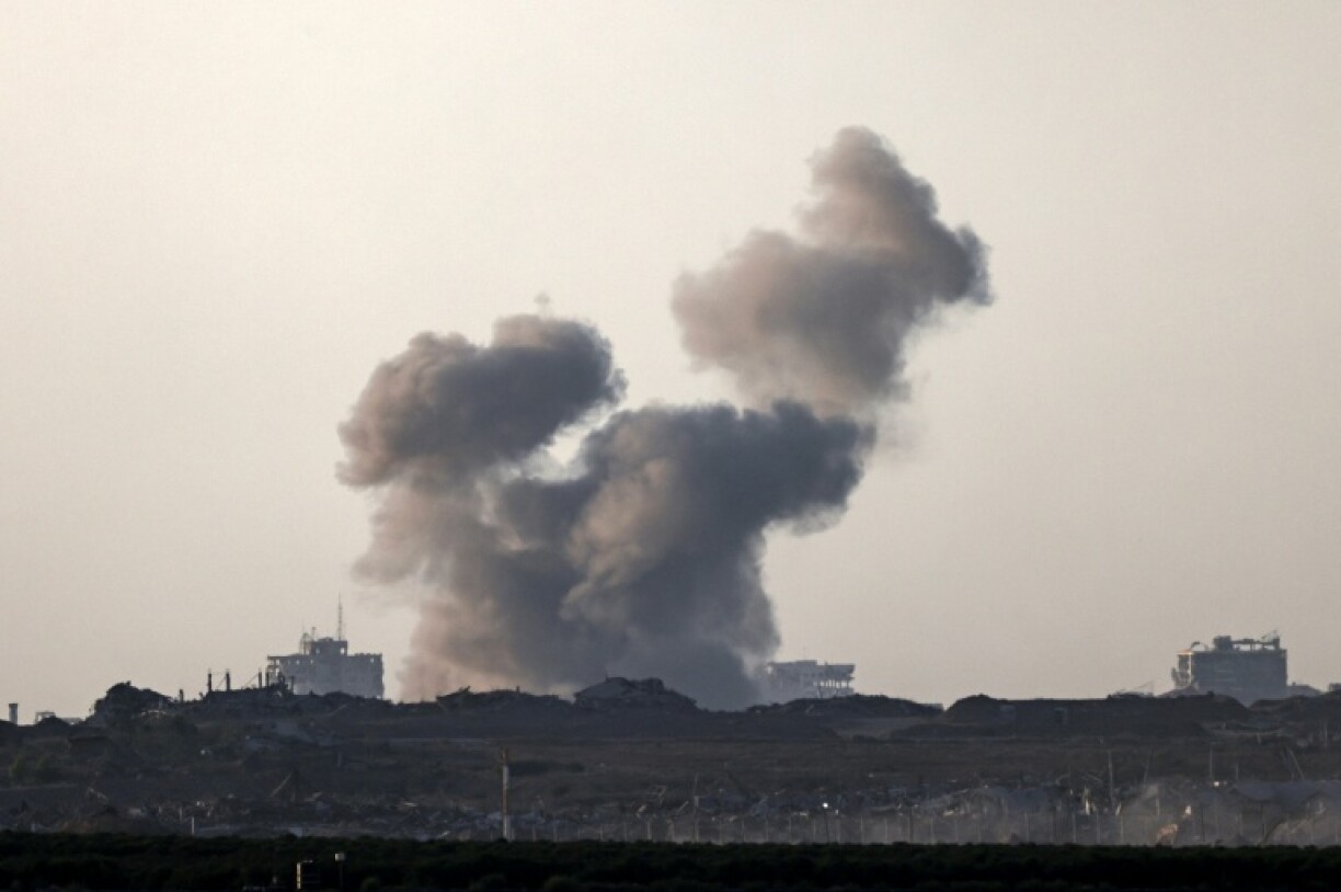 This picture taken from a position on the Israeli border with the Gaza Strip, shows smoke rising during an Israeli strike on the besieged Palestinian territory