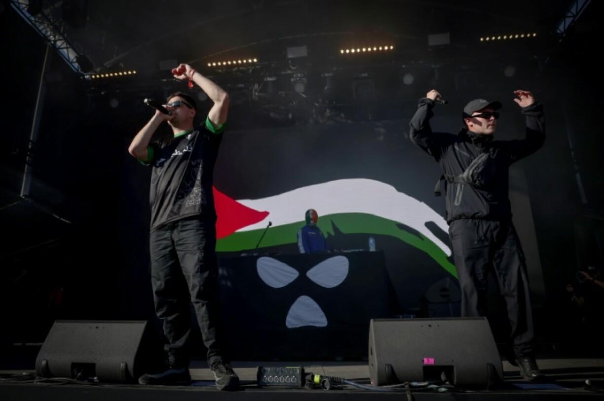 Northern Ireland hip-hop trio Kneecap perform on stage at the Rock en Seine music festival near Paris on August 24, 2025