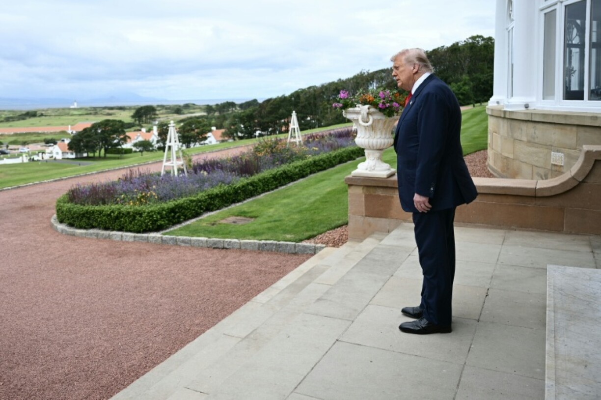 Trump waits to greet Starmer and his wife, Victoria, at the Trump Turnberry Golf Courses in Scotland