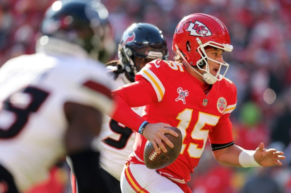 Patrick Mahomes of the Kansas City Chiefs scrambles for a rushing touchdown in an NFL victory over Houston