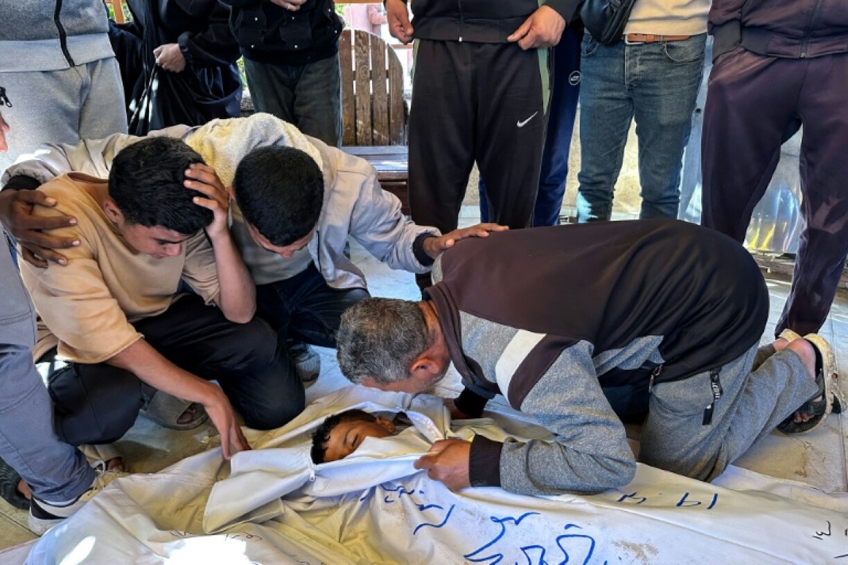 Mourners at Nasser Hospital in Khan Yunis, southern Gaza, bid farewell to a Palestinian child killed in an Israeli strike