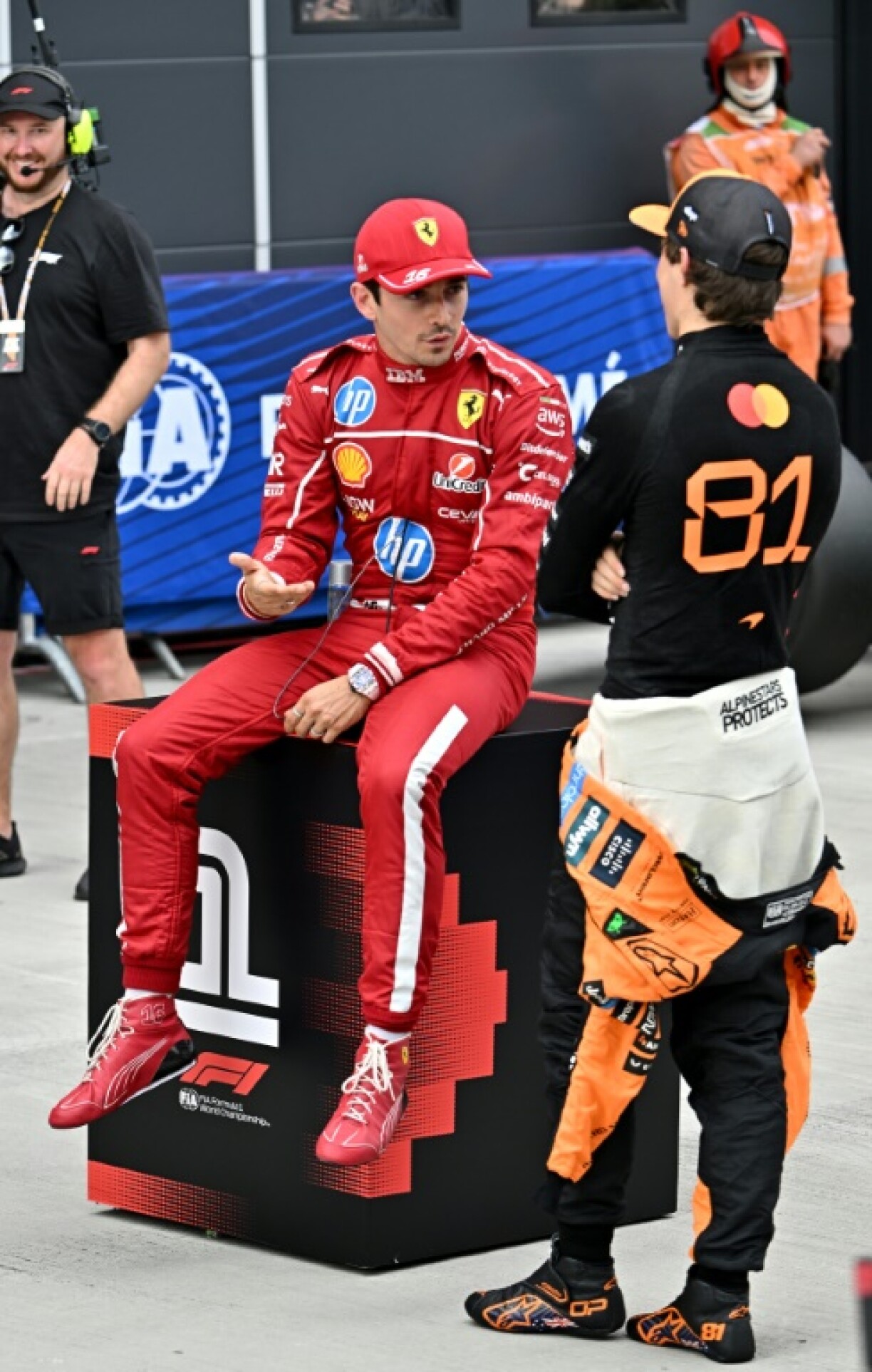 Series leader Oscar Piastri (R) of McLaren finished second behind Ferrari's Charles Leclerc (L) in qualifying for the Hungarian Grand Prix