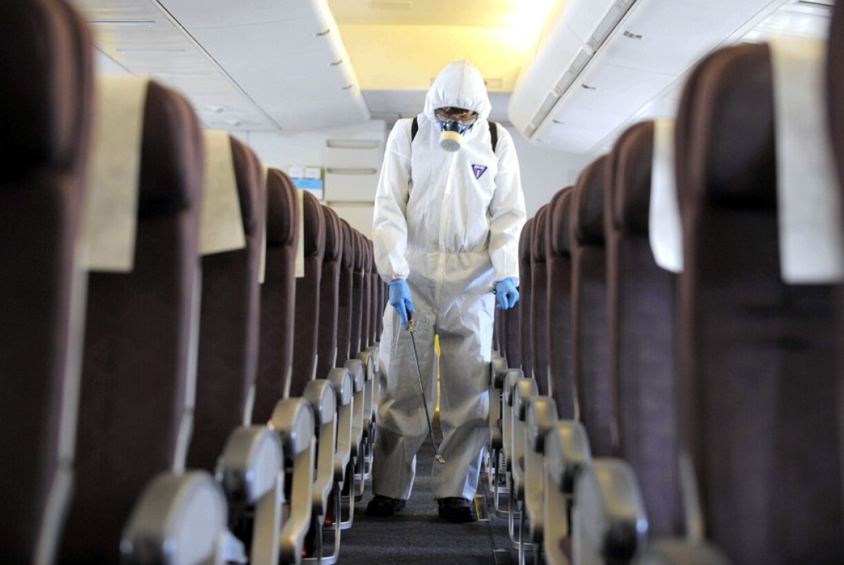 A Vietnam Airlines plane being decontaminated in March 2020.