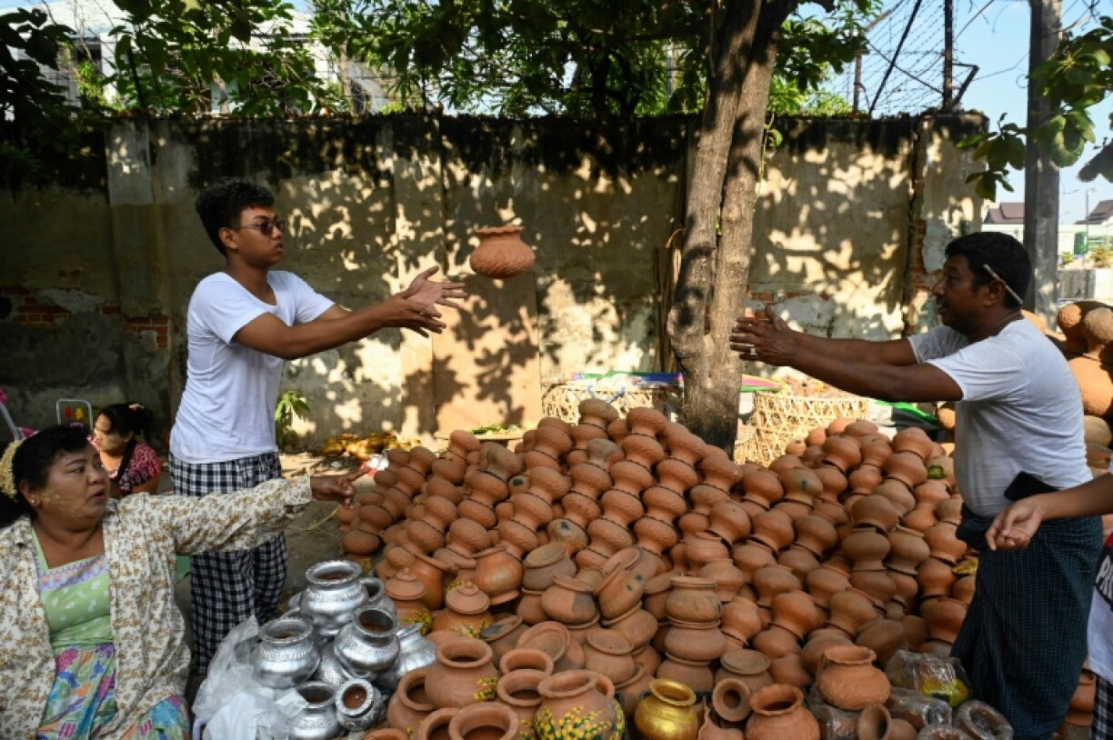 Early on Sunday families were buying clay pots and plant sprigs customarily placed inside homes to welcome the new year
