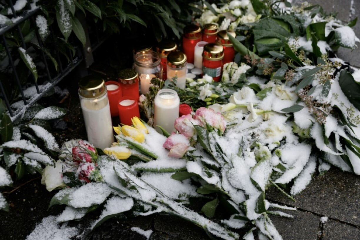 Flowers and candles have been left at the scene of the car-ramming, the latest such incident to shock Germany