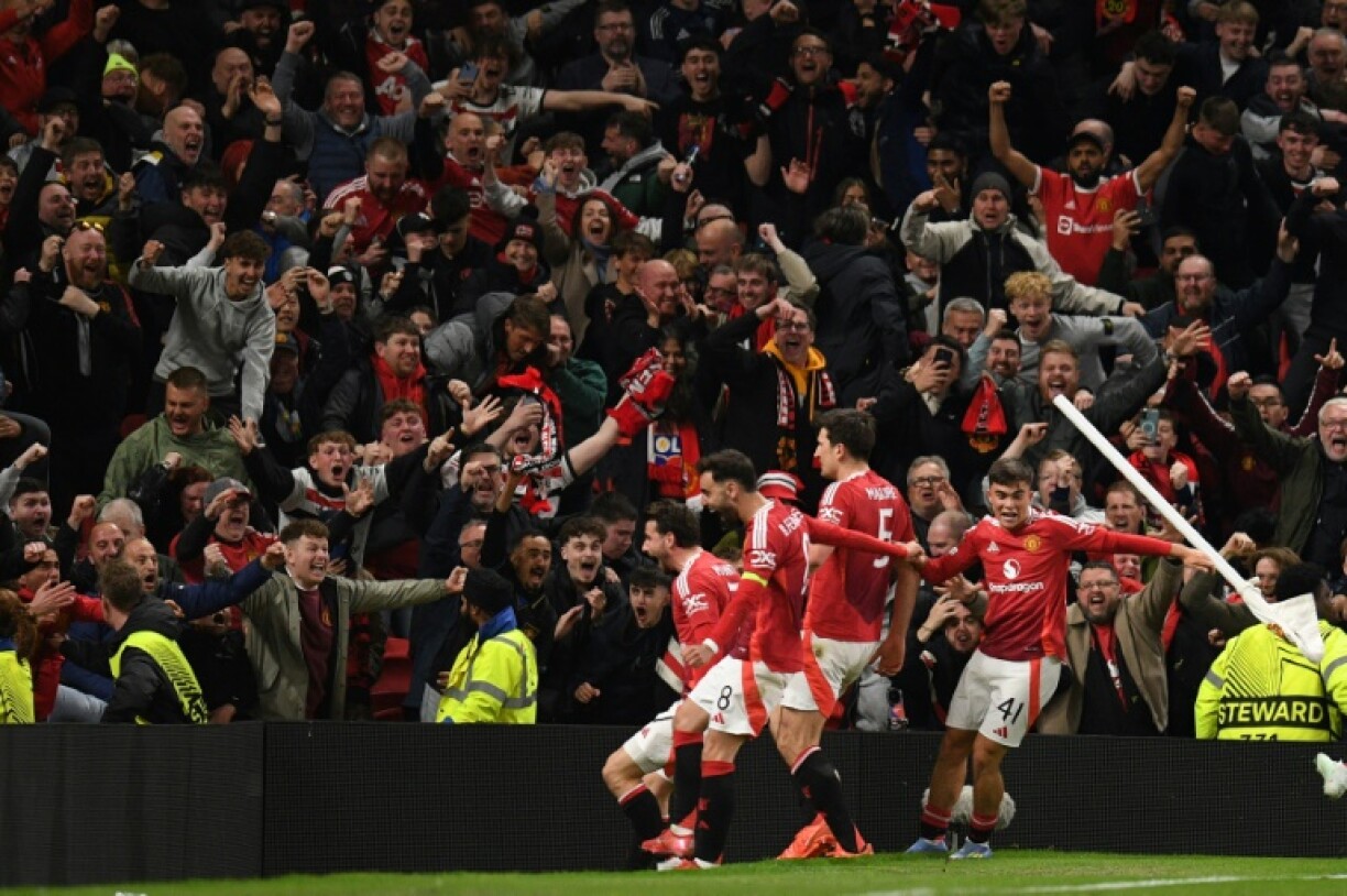 Manchester United celebrate after completing their comeback against Lyon in the Europa League quarter-finals