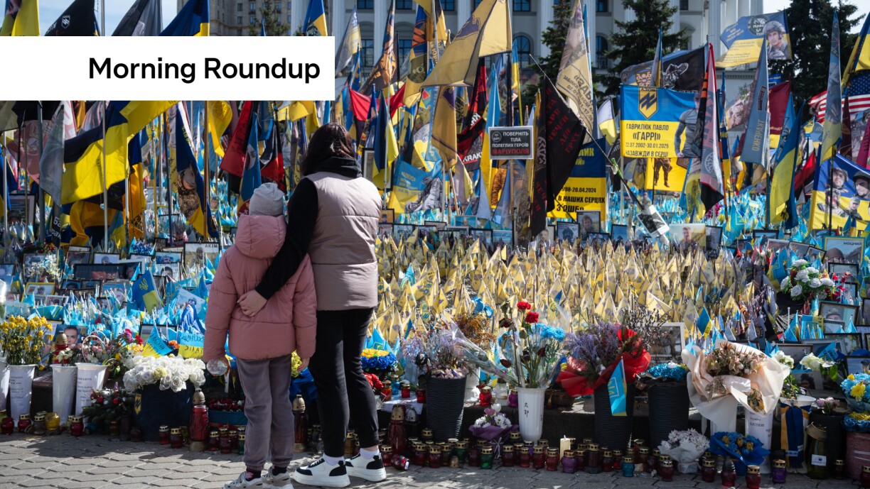 Citizens looks at the flags of Ukraine, the United States and others at Independence square during the commemoration ceremony for the six Americans, who died fighting for Ukraine during Russia-Ukraine war in Kyiv on 14 March.