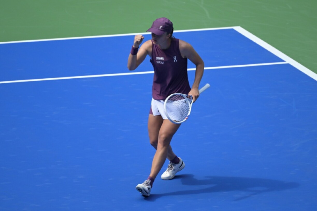 Iga Swiatek reacts after a point against fellow Pole Magdalena Frech