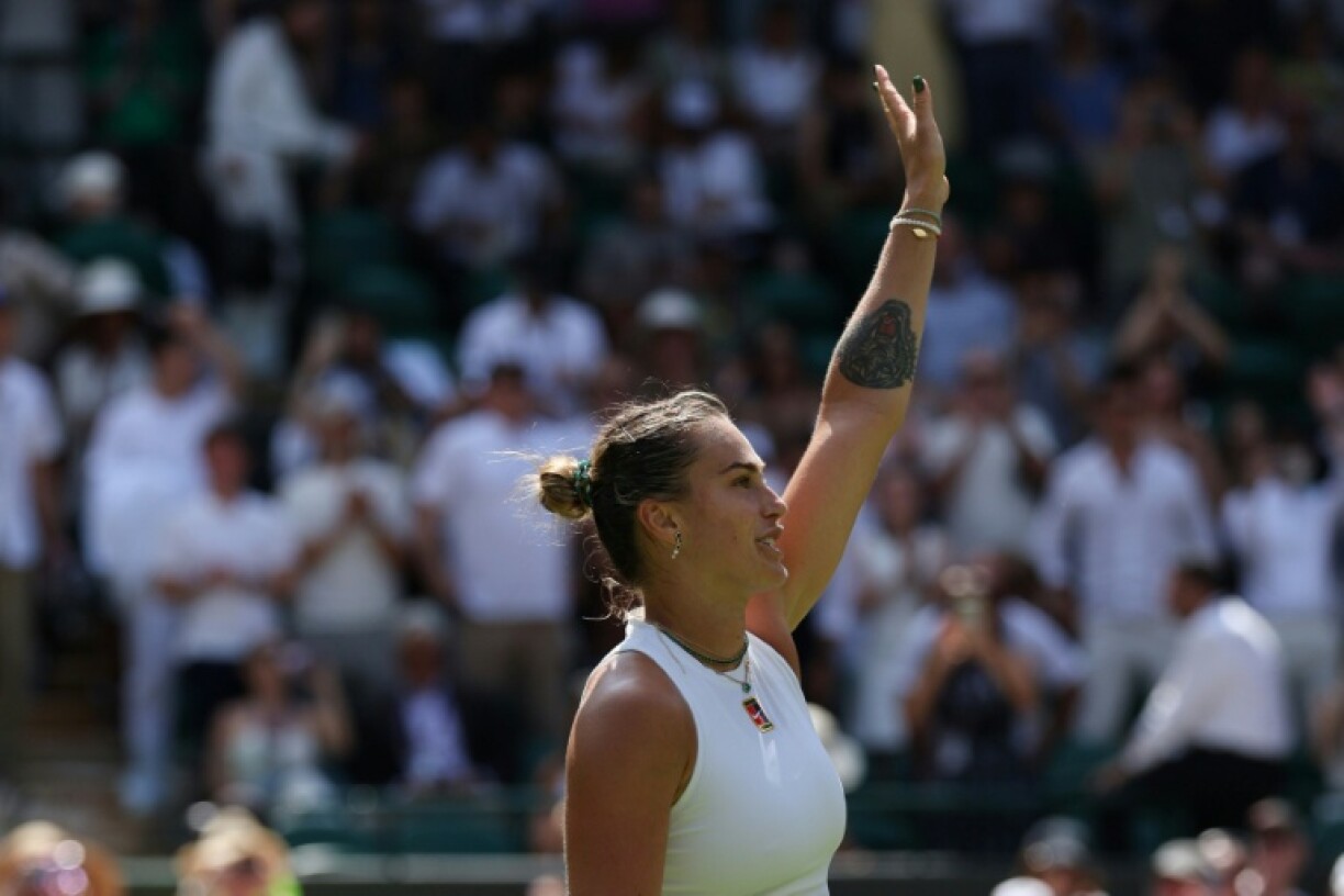 Aryna Sabalenka celebrates after beating Carson Branstine in the first round at Wimbledon