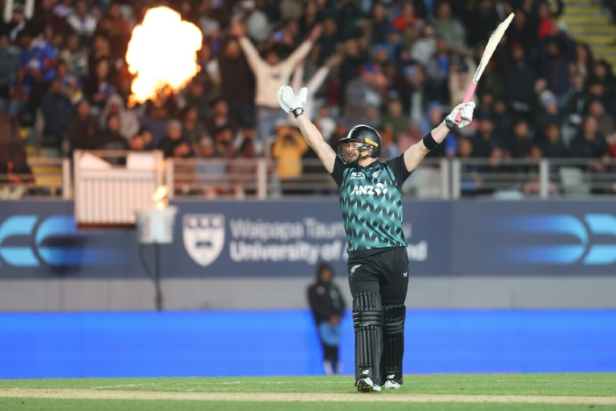 New Zealand's Glenn Phillips celebrates his century during the 4th T20 cricket match between New Zealand and India at Eden Park in Auckland on October 30, 2026.