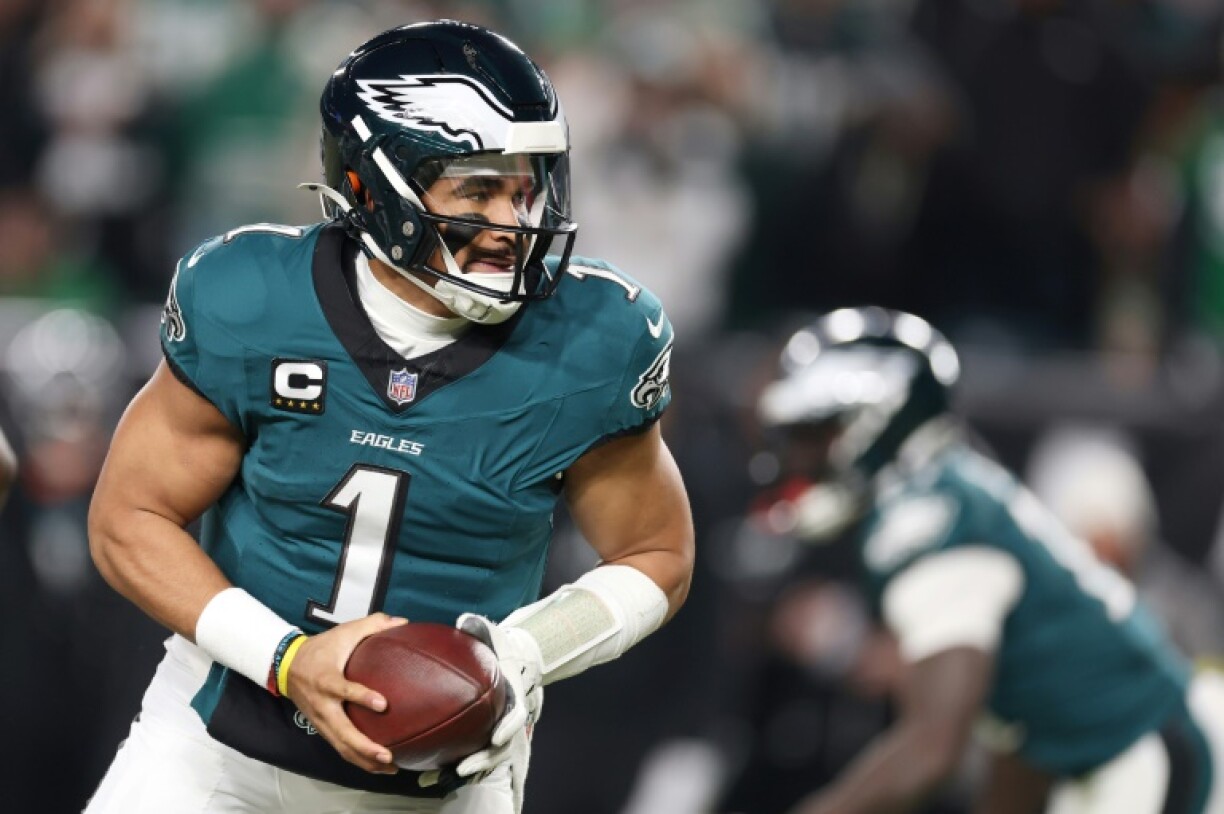 Philadelphia quarterback Jalen Hurts rolls out in the Eagles' NFL playoff victory over the Green Bay Packers