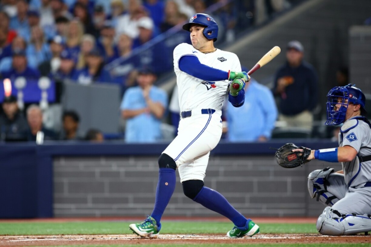 George Springer of the Toronto Blue Jays hits a double in game two of the World Series against the Los Angeles Dodgers