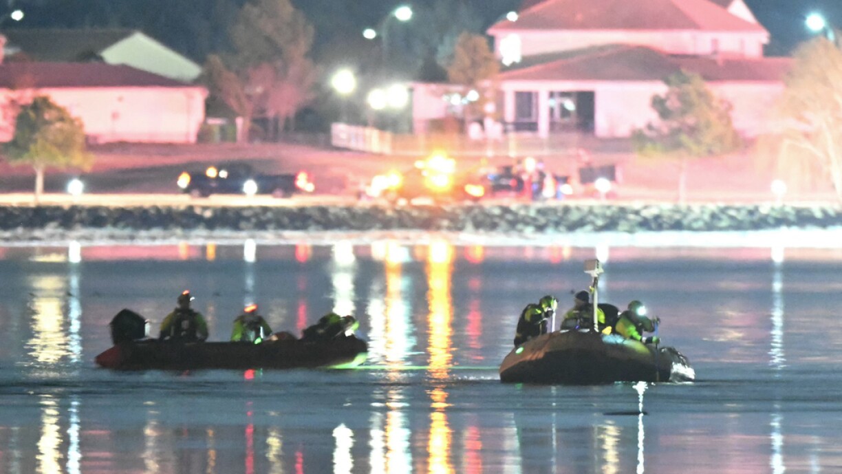 Rescue boats search the waters of the Potomac River after a plane on approach to Reagan National Airport crashed into the river outside Washington DC on 30 January 2025.