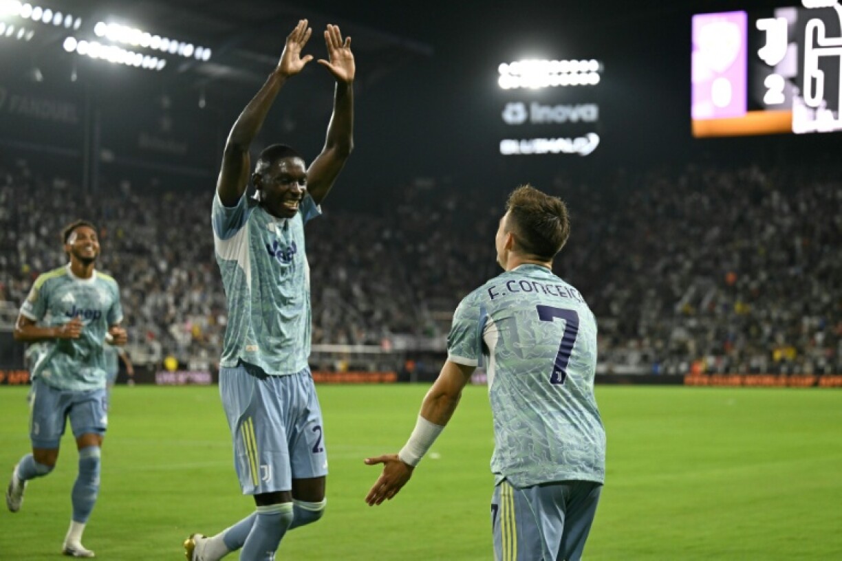 Juventus' Portuguese forward Francisco Conceicao celebrated with Randal Kolo Muani as they thrashed Al Ain in Washington