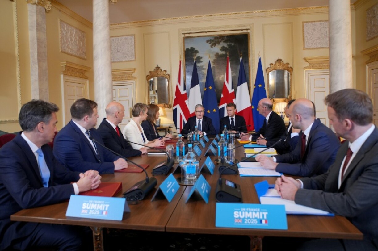 British and French ministers were meeting to thrash out a migration deal