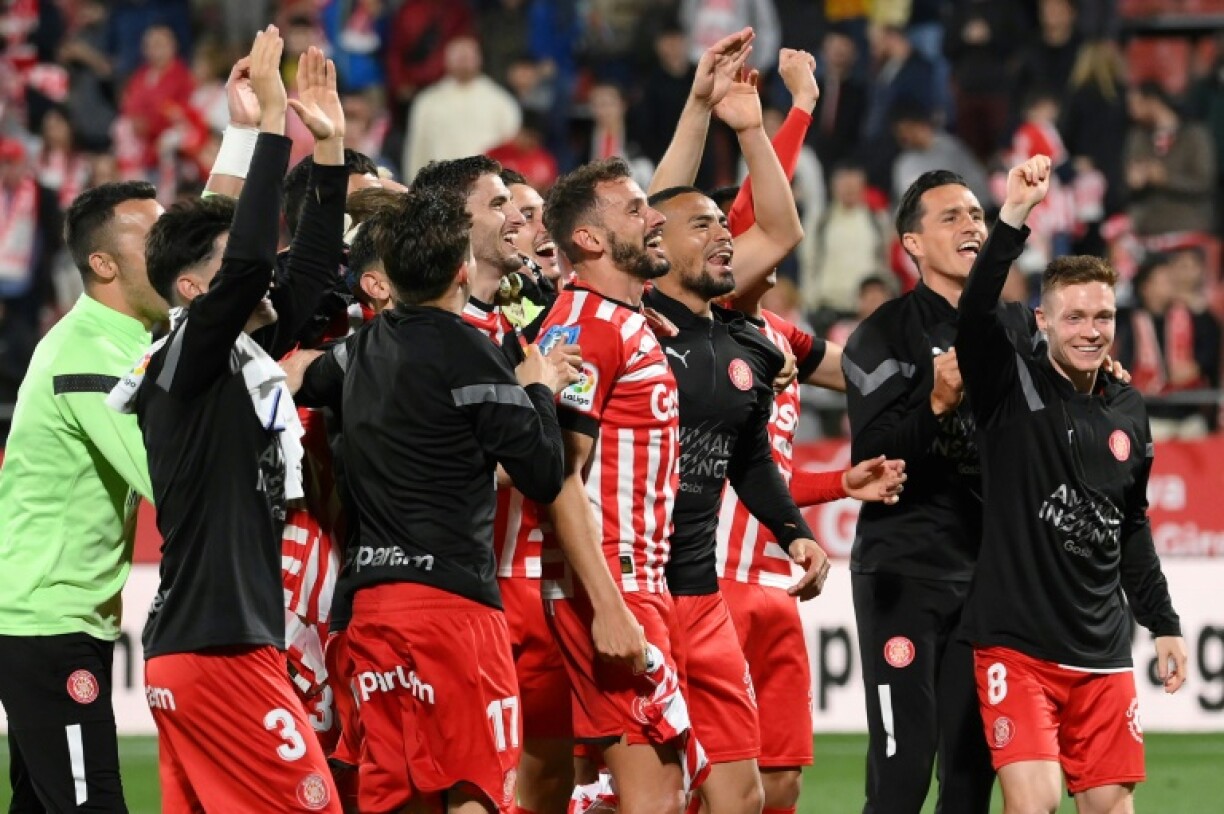 Les joueurs de Gérone célèbrent leur victoire 4-2 contre le Real Madrid mardi en championnat d'Espagne, à domicile au stade Montilivi.