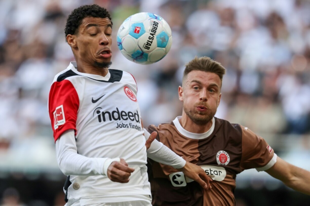 Eintracht Frankfurt striker Hugo Ekitike (L) is reportedly set to join Liverpool