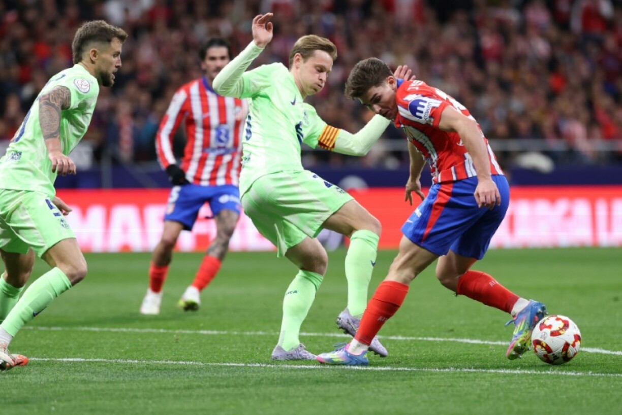 Barcelona's Dutch midfielder Frenkie De Jong (C) has found his footing after a few tricky years at the club
