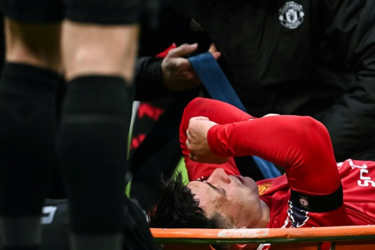 Manchester United defender Lisandro Martinez is carried off the pitch at Old Trafford on a stretcher