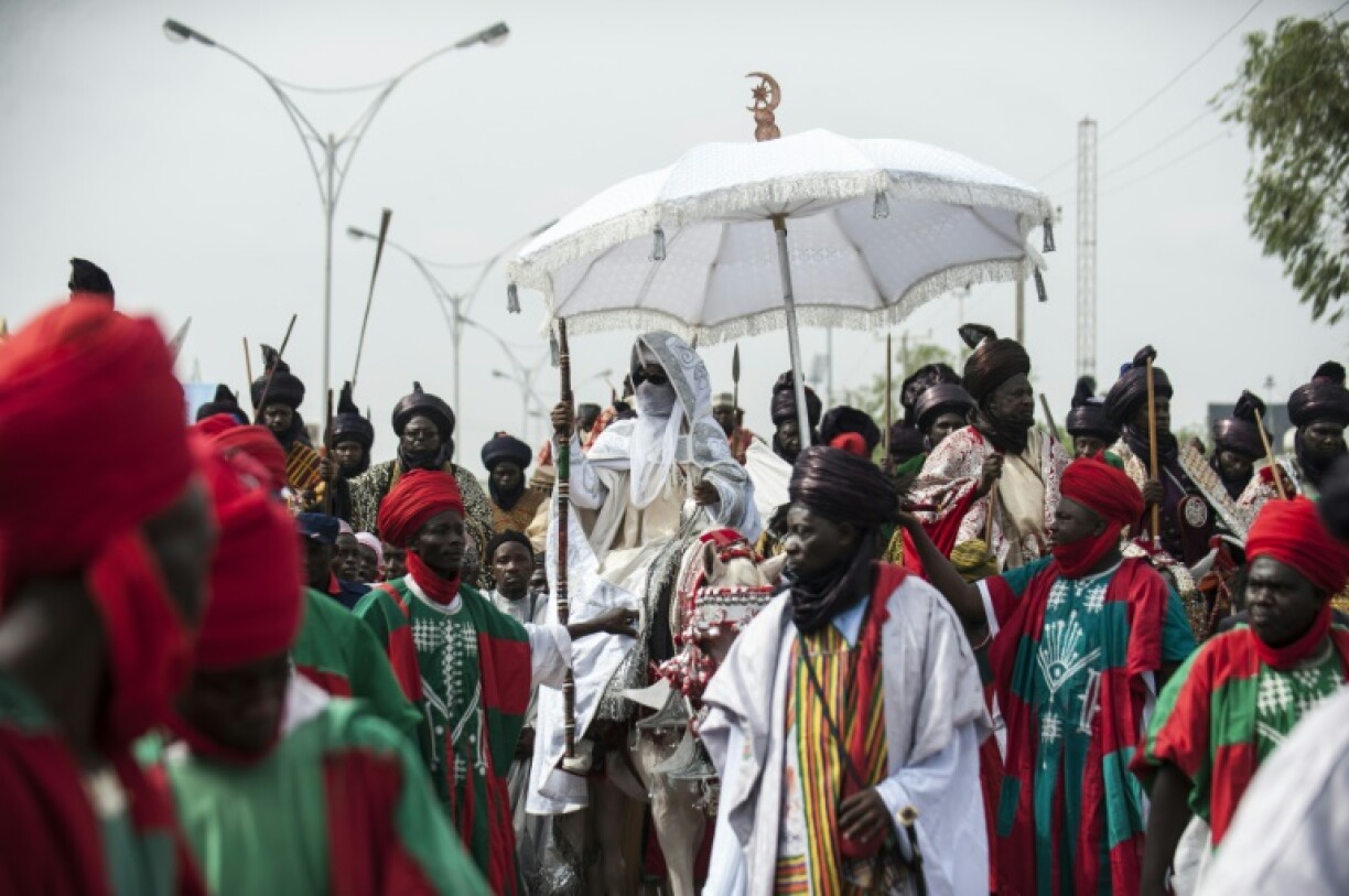 The Emir of Kano parades through the streets of Kano during the Durbar Festival in Kano, northern Nigeria