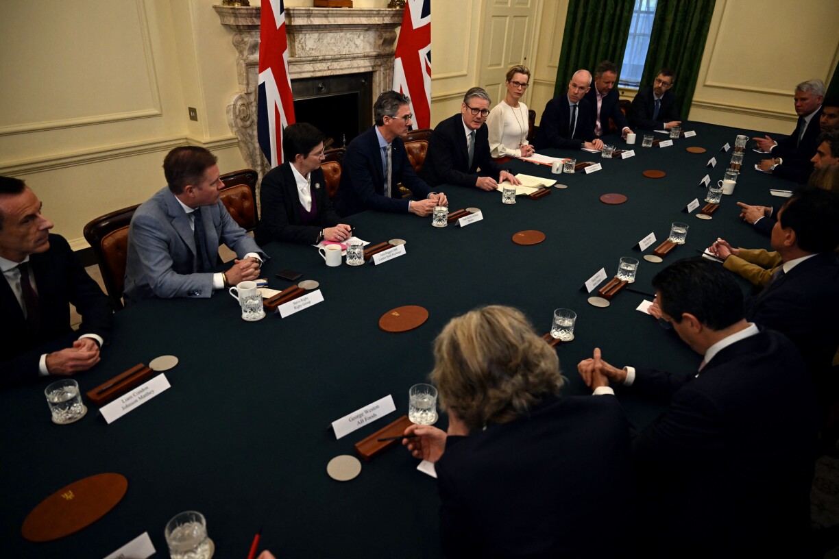 Britain's Prime Minister Keir Starmer (back C) chairs a roundtable with UK business leaders in Downing Street in London on April 3, 2025. Starmer told business chiefs at his Downing Street office that