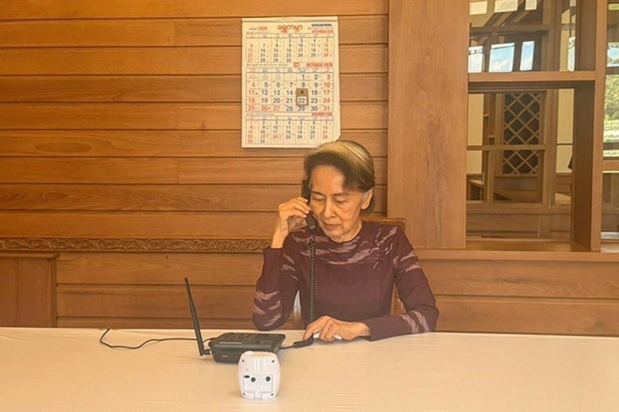 This handout photo taken and released on October 22, 2026 by the spokesperson for the President Myanmar shows ousted leader Aung San Suu Kyi speaking on the phone to her younger son Kim Aris