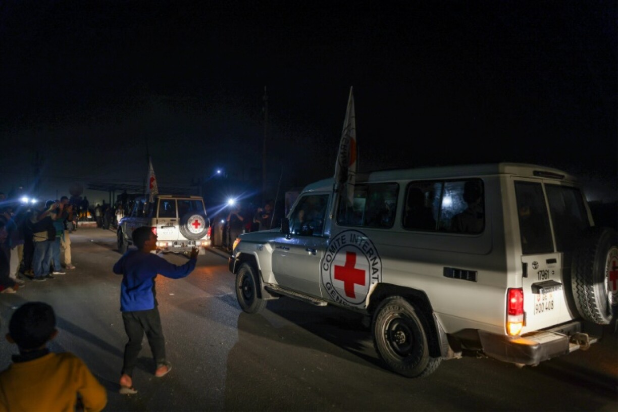 Red Cross jeeps reportedly carrying Israeli hostages cross the Rafah border point between Gaza and Egypt
