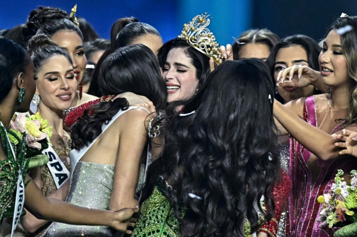 Miss Mexico Fatima Bosch (C) is surrounded by contestants as she celebrates winning the 2025 Miss Universe pageant in Nonthaburi