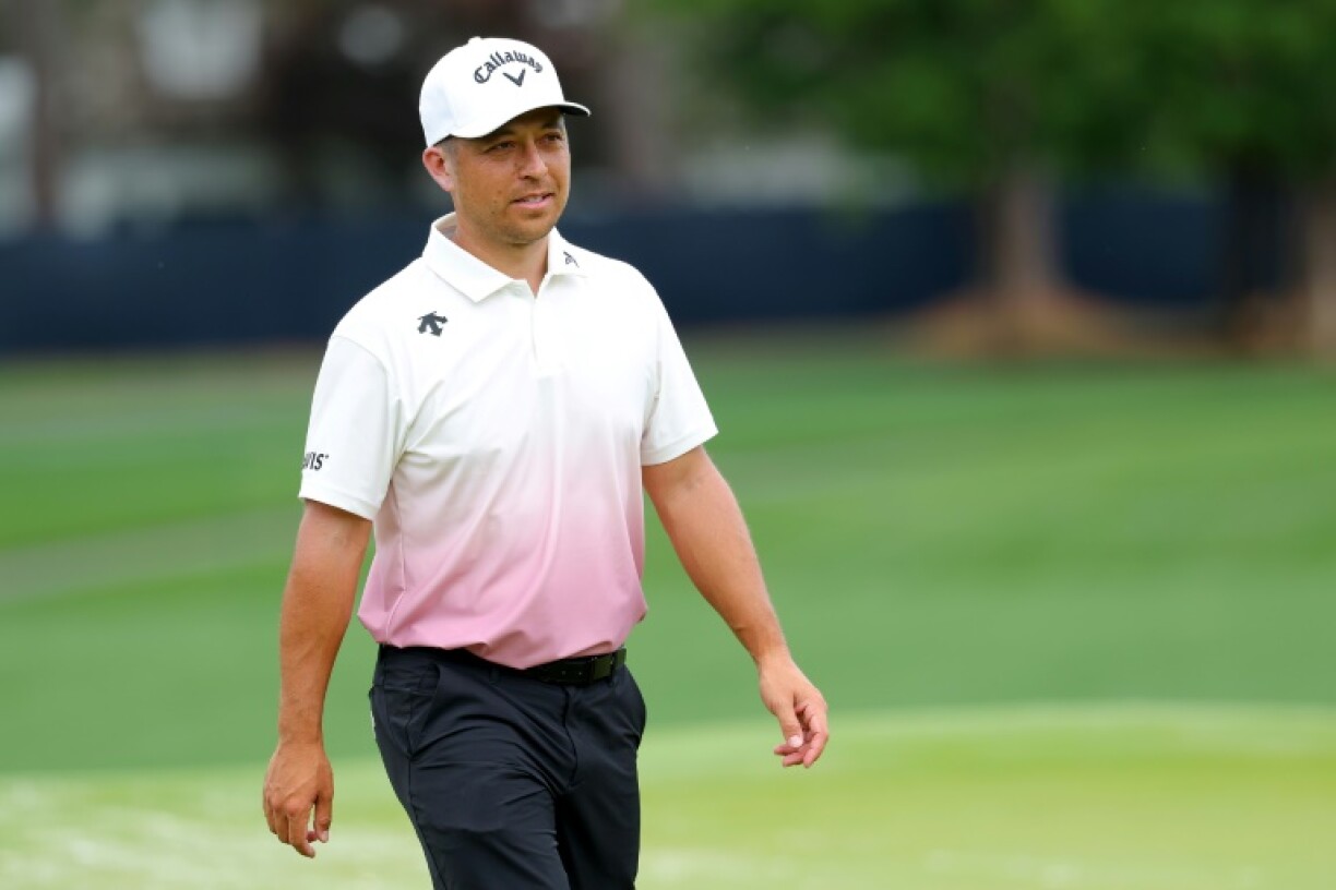 Defending champion Xander Schauffele of the United States walks on the fourth green during a practice round for the 107th PGA Championship at Quail Hollow
