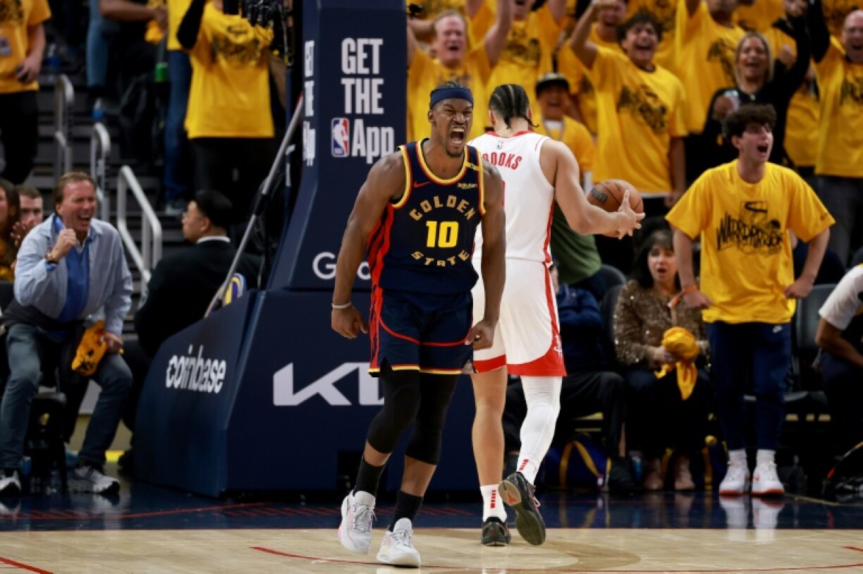 Jimmy Butler celebrates after returning from injury to help Golden State edge past the Houston Rockets