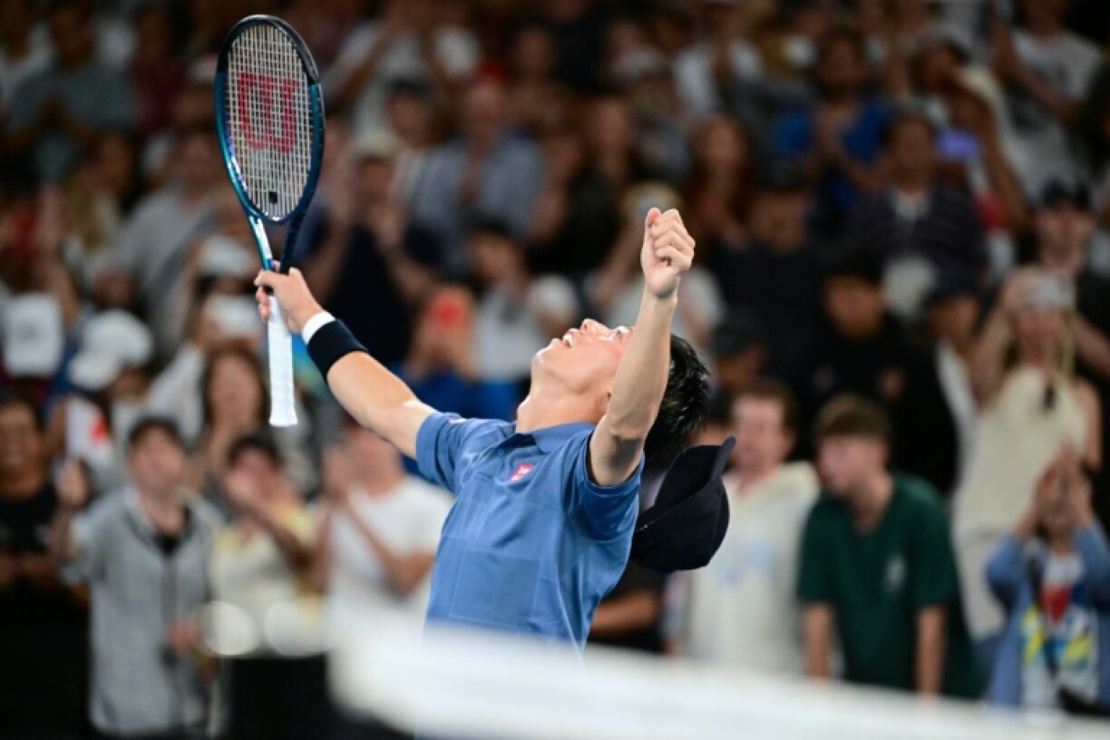 Japan's Kei Nishikori celebrates after his five-set victory against Brazil's Thiago Monteiro at the Australian Open