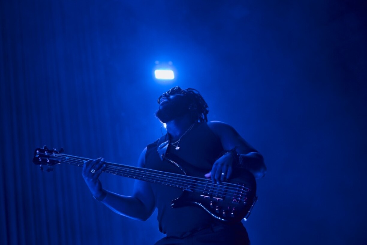 TJ Koleoso plays bass in the band