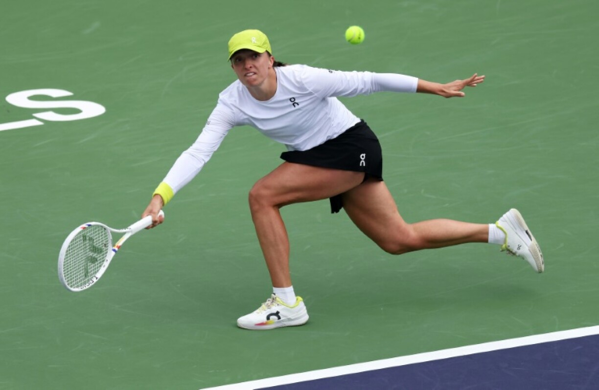Iga Swiatek of Poland plays a forehand on the way to a quarter-final victory over China's Zheng Qinwen at Indian Wells