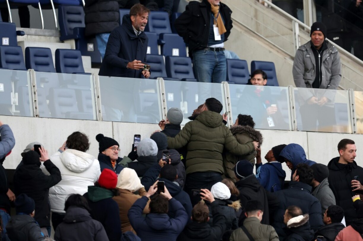 Jurgen Klopp (top) talks to fans at the end of the French Ligue 2 football match between Paris FC and Amiens