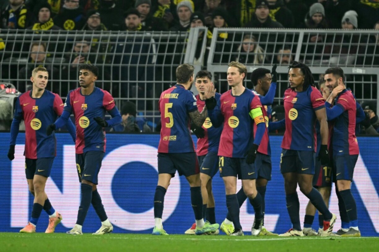 Ferran Torres (R) was the hero for Barcelona with two goals as a substitute in a thrilling 3-2 win at Dortmund