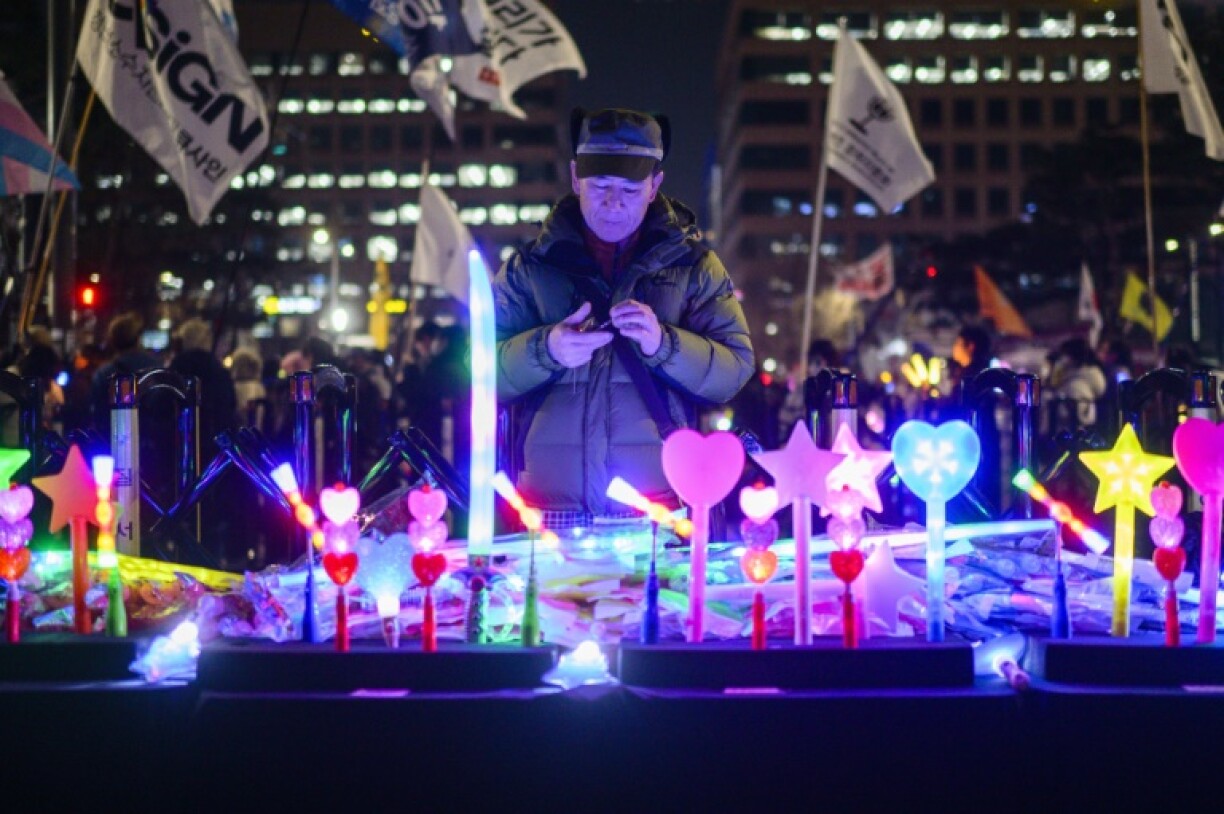 A vendor sells light sticks as demonstrators take part in a protest calling for the ouster of South Korea President Yoon Suk Yeol