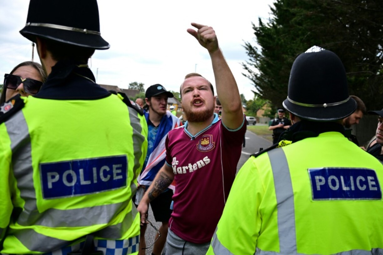 An anti-immigration protestor outside a hotel south of London believed to be housing asylum seekers