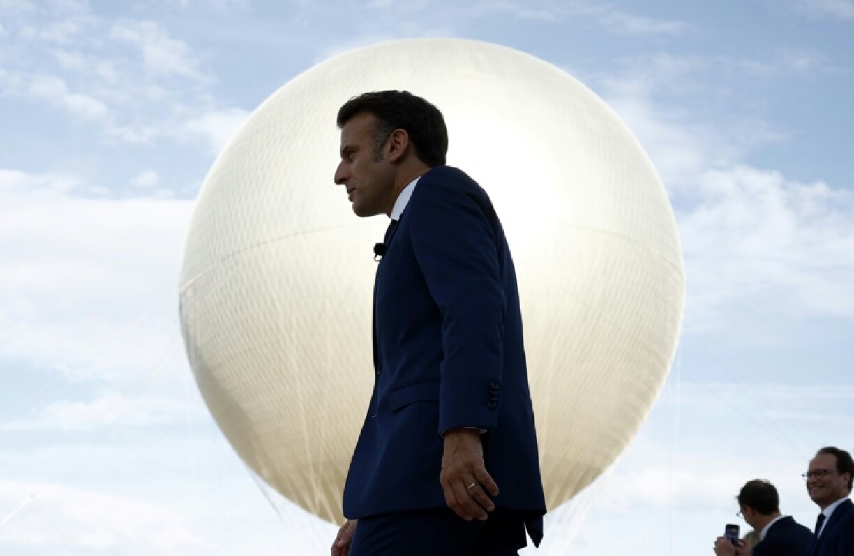 On the rise: French President Emmanuel Macron at the reinstallation of the Olympic cauldron at the Tuileries Garden in Paris, on June 12