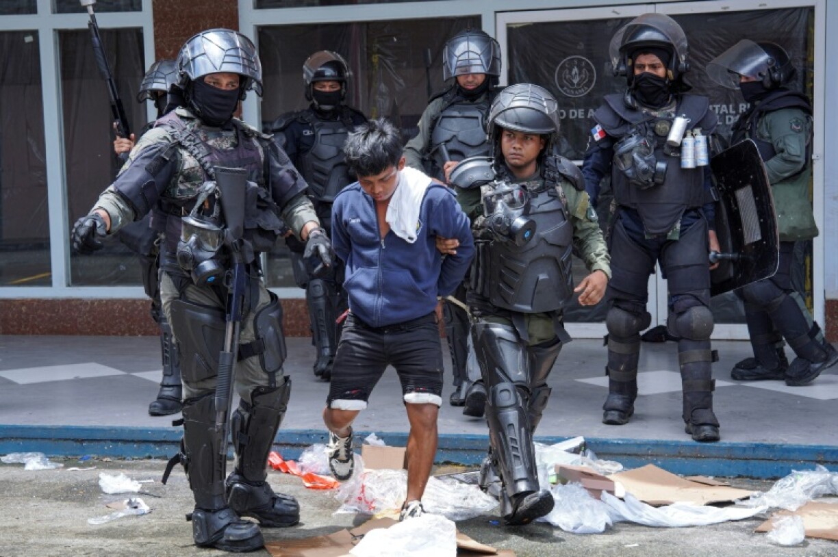 Anti-government protesters clashed with police and vandalized businesses in Bocas del Toro province in a two-month-long dispute over pension reforms
